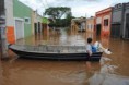 Rio Piracicaba transborda, e cinco famílias deixam a rua do Porto